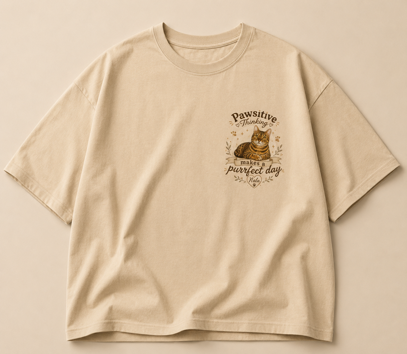 Beige oversized T-shirt with an illustrated Nala cat chest print